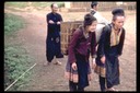 Hmong women with back baskets, Bua Chan, Thailand, 1986